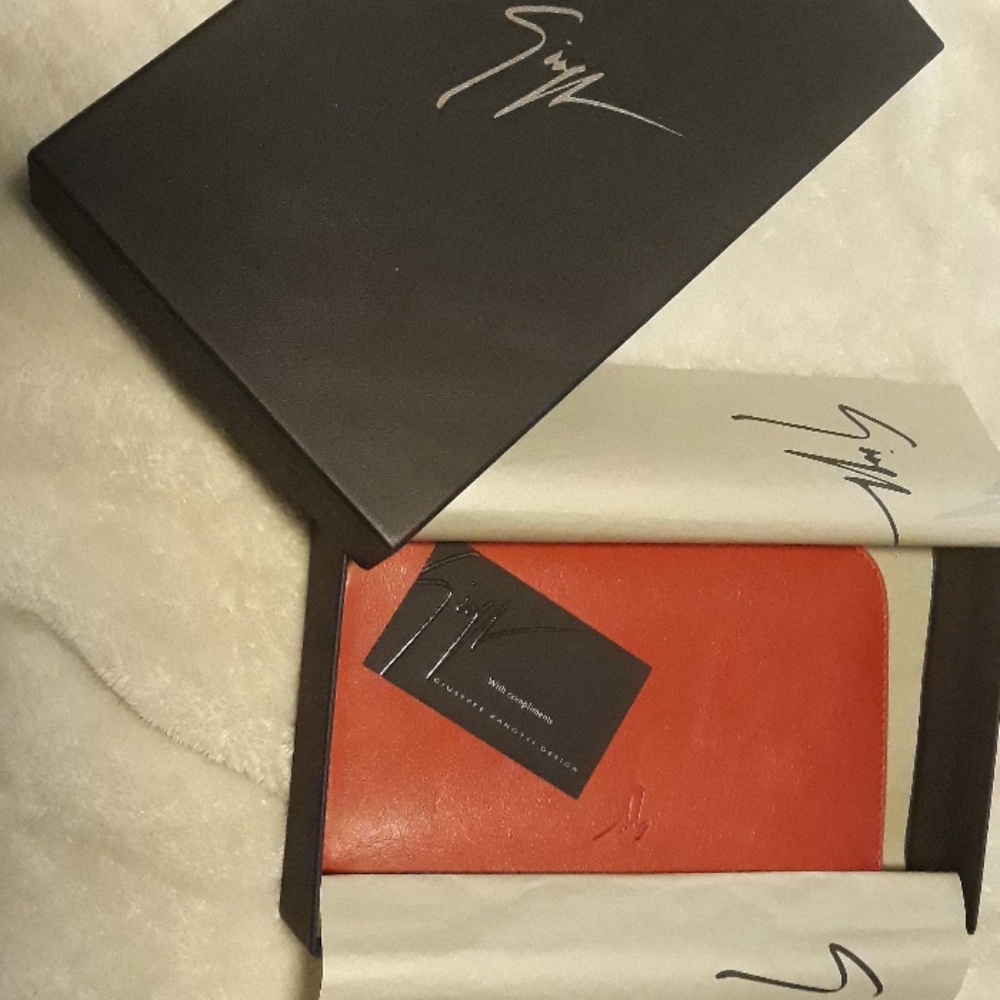 Giuseppe Zanoti red leather clutch.  Brand new.